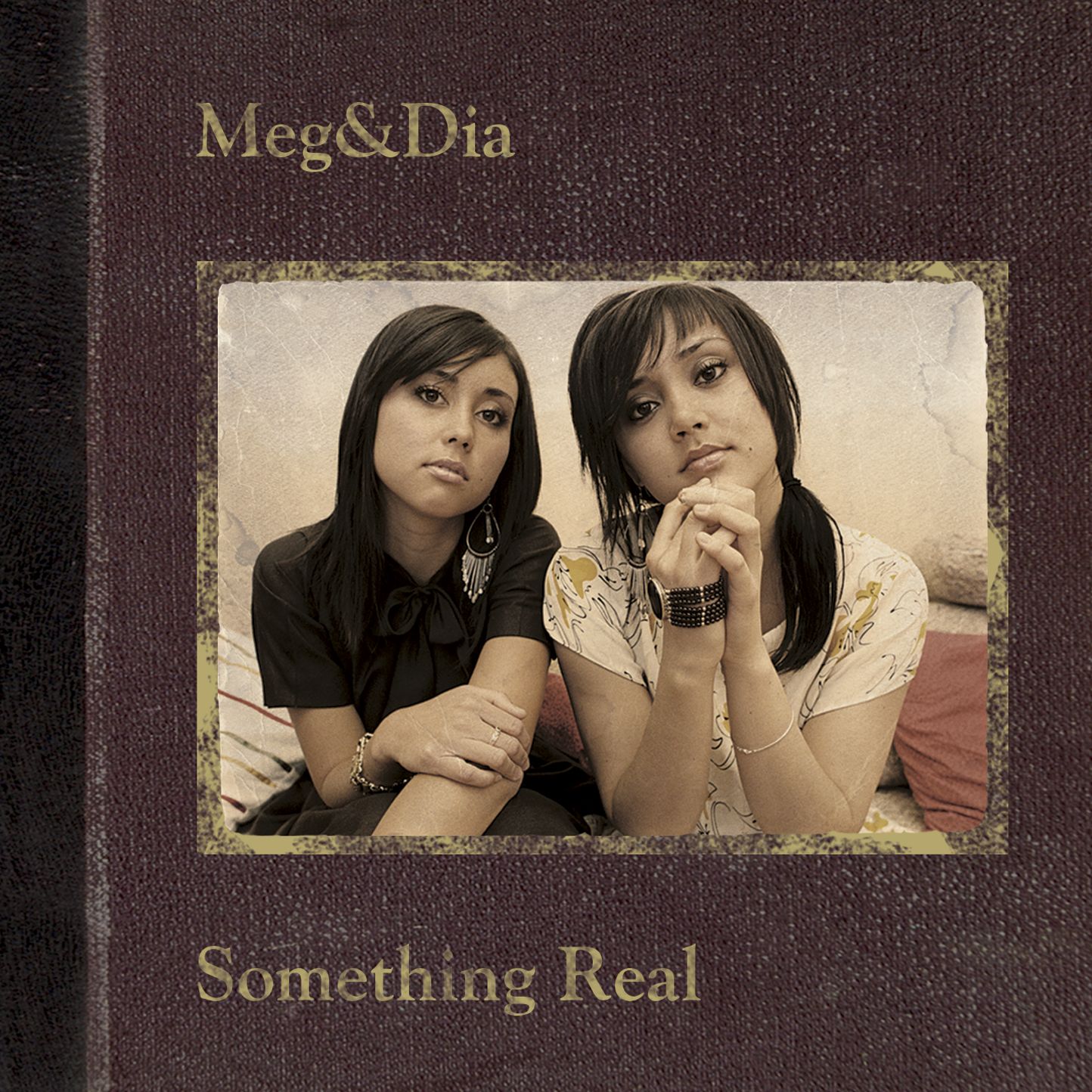 Something Real by Meg & Dia; sepia toned image of Meg & Dia looking at the camera